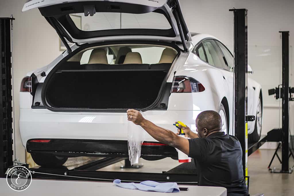 White Tesla model S being worked on