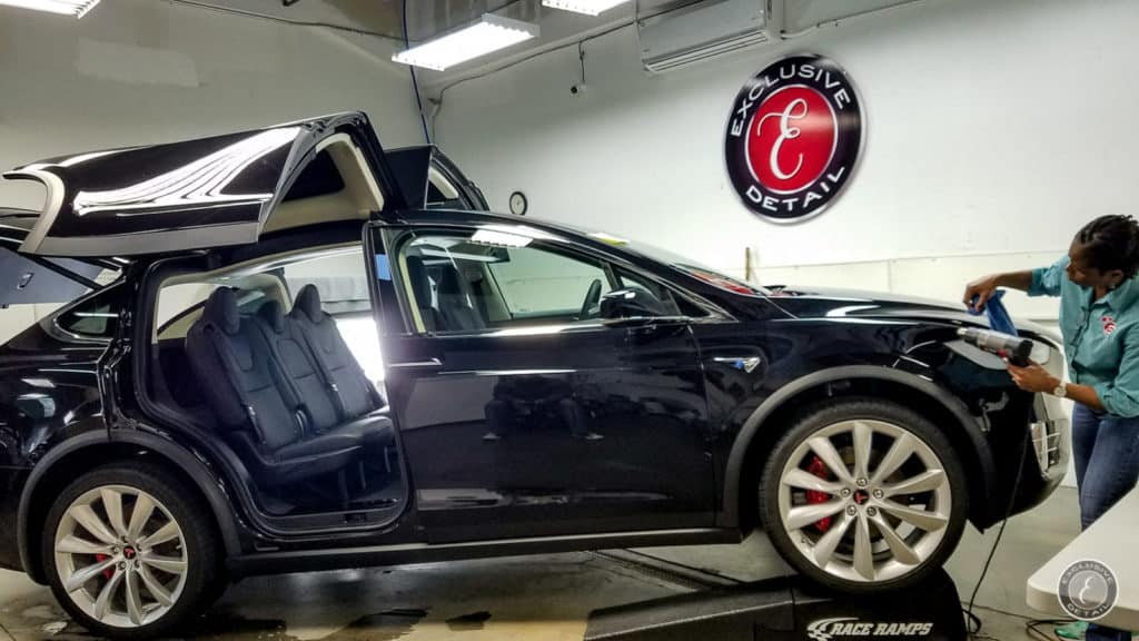 Tesla model X during paint protection installation