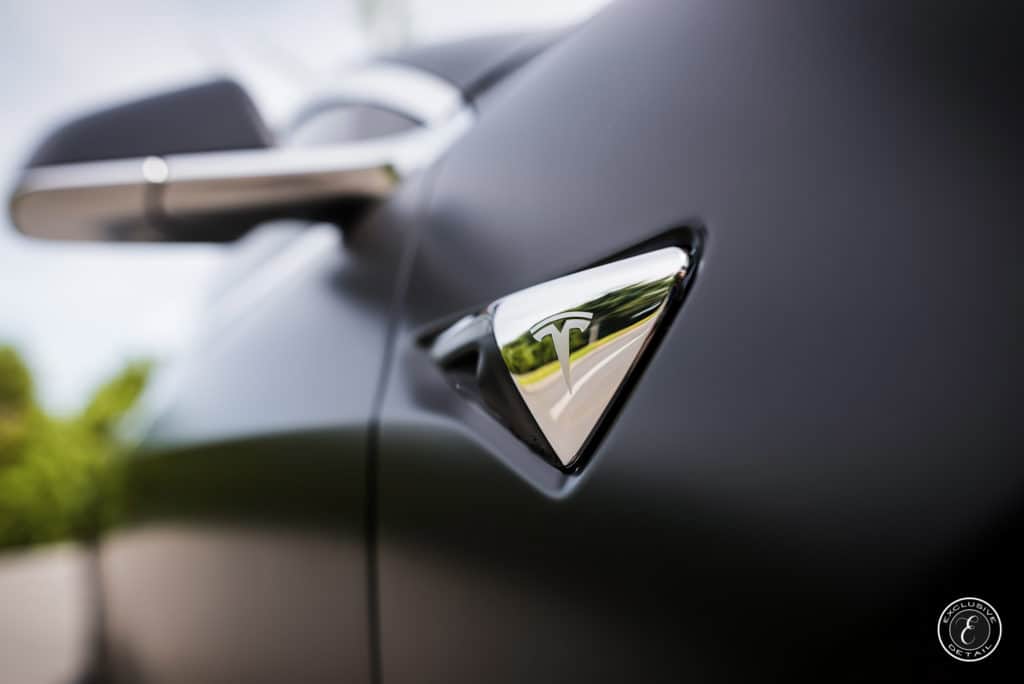 Telsa model 3 with paint protection film chrome logo